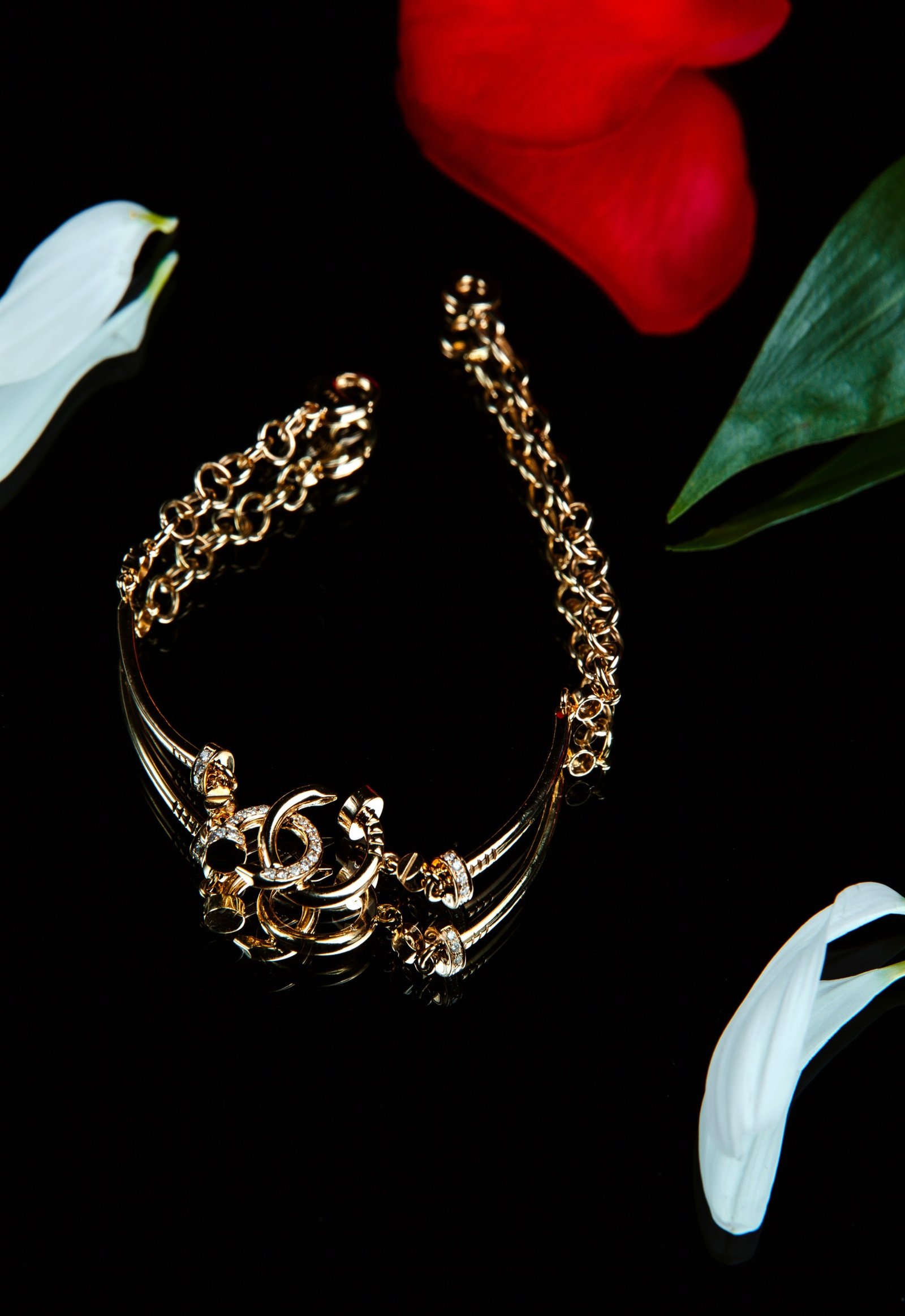 top-view-golden-bracelet-with-diamonds-black-wall (1)